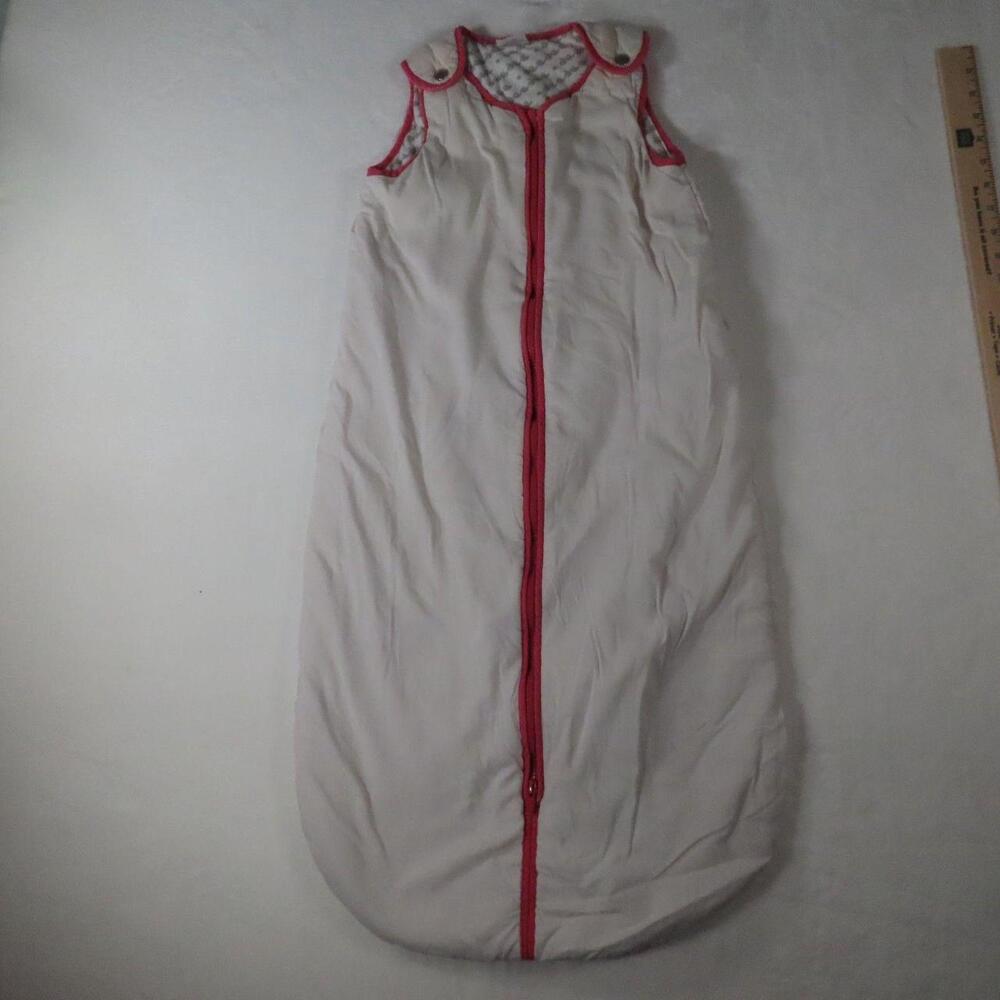 The Baby DeeDee Sleep Nest Sleep Sack in white is a cozy and safe sleeping solut
